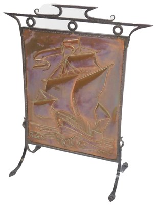 Lot 556 - An Arts and Crafts firescreen, the embossed...