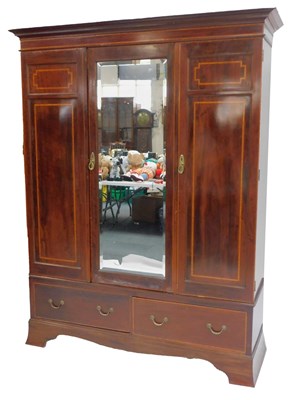 Lot 665 - An Edwardian mahogany and inlaid wardrobe, the...