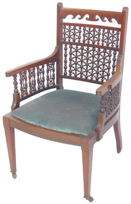Lot 645 - An Anglo-Moorish mahogany armchair in Liberty...