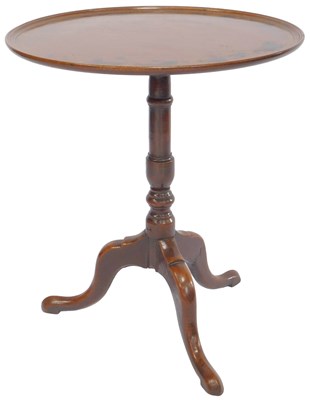 Lot 659 - A 19thC oak tripod table, the circular dished...