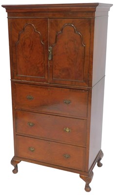 Lot 638 - A walnut cabinet, the top with a moulded edge...
