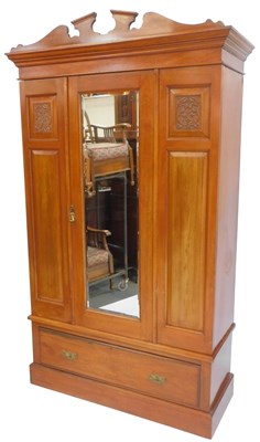 Lot 654 - An Edwardian walnut single wardrobe, the top...