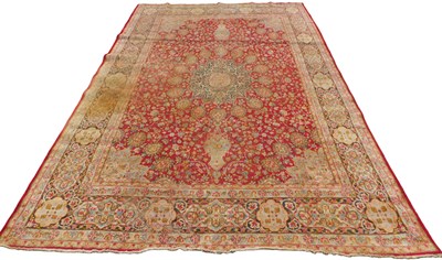 Lot 672 - A Persian rug, red ground, with central...