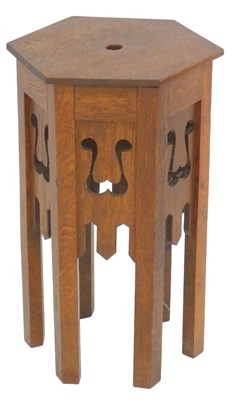 Lot 653 - An early 20thC oak plant stand in Liberty...