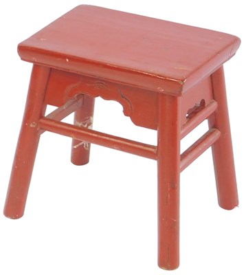 Lot 651 - An early 20thC red painted Chinese stool, the...