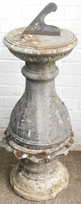 Lot 547 - A composition stone sundial, the metal dial on...