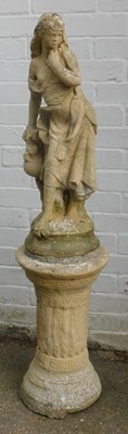 Lot 549 - A painted composition stone figure, modelled...