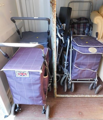 Lot 1136 - A folding wheelchair and four folding shopping...