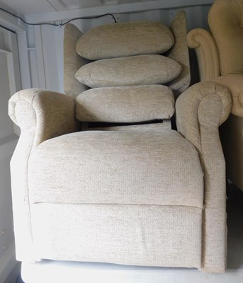 Lot 1143 - A beige upholstered reclining armchair, with...