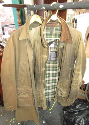 Lot 2193 - A Barbour wax jacket and another by Topman. (2)