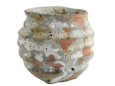 Lot 259 - A Studio pottery coiled vase, with heavy white...