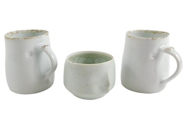 Lot 265 - Two Studio ceramic mugs, each with a pale...