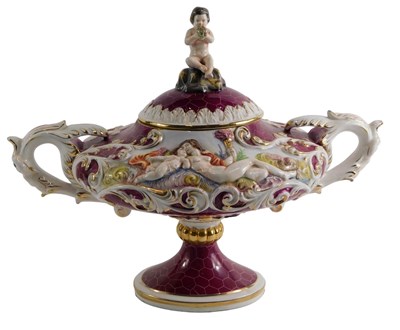 Lot 103 - A Capodimonte urn and cover, on a purple...