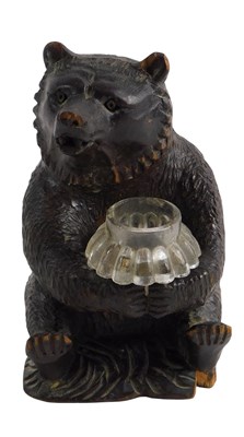 Lot 164 - A carved Black Forest bear posy vase, with...
