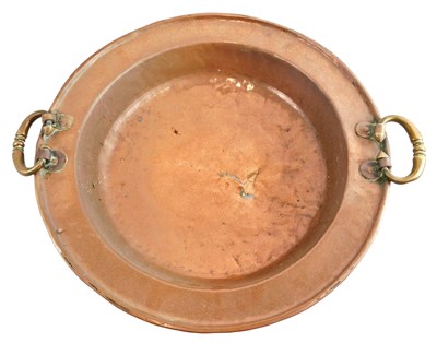Lot 211 - An early 19thC copper bowl, with hammered...