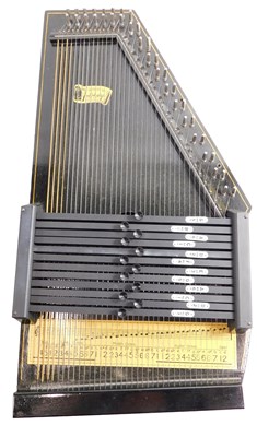 Lot 221 - An ebonised and gilt painted autoharp, with...