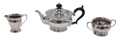 Lot 60 - A George V silver three piece tea set, of...