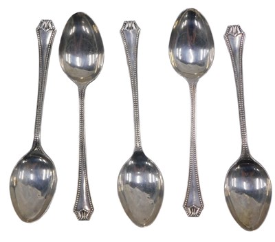 Lot 74 - A set of five George V silver teaspoons, with...