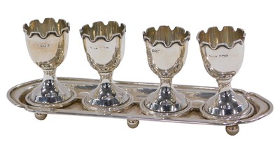Lot 70 - An Edward VIII silver egg cruet, the stand of...