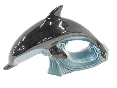 Lot 302 - A Poole Pottery dolphin, riding the wave, 20cm...