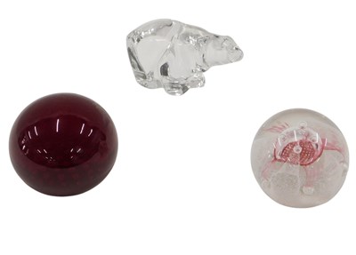 Lot 311 - Three 20thC glass paperweights, comprising...