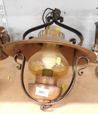 Lot 2021 - A copper and wrought iron electric hanging lamp.