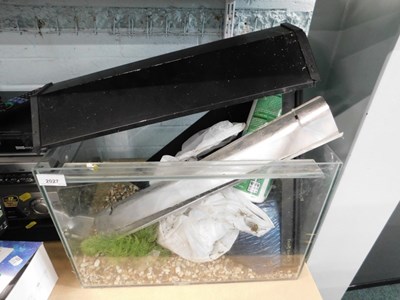 Lot 2027 - A glass aquarium, together with gravel,...