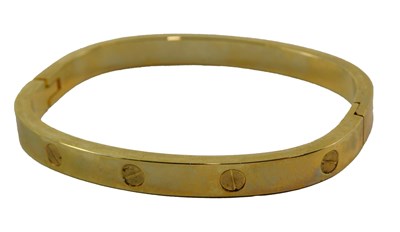 Lot 332 - A gold plated hinged love bangle, 5.1cm...