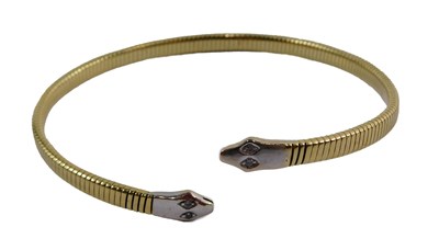 Lot 352 - A snake bangle, the snake head set with two...