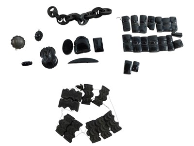Lot 327 - A group of loose jet beads, some carved, 73.3g...