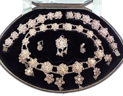 Lot 427 - A late 19th/early 20thCwhite metal filigree...