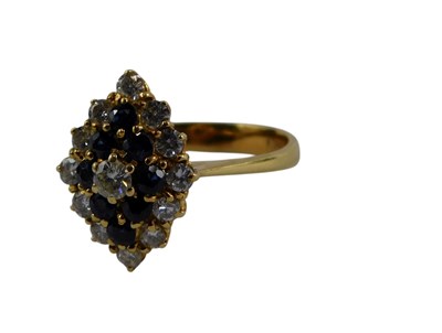 Lot 271 - A sapphire and diamond marquise shaped dress...