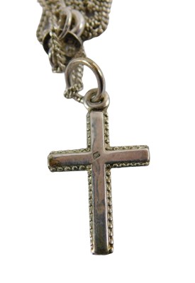 Lot 387 - A silver crucifix pendant and chain, the...