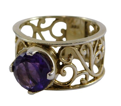 Lot 395 - A Celtic style dress ring, set with amethyst,...