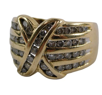 Lot 396 - A 9ct gold diamond set crossover ring, the...