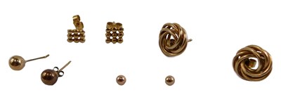 Lot 337 - Four pairs of 9ct gold stud earrings,...
