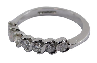 Lot 339 - An 18ct gold diamond half hoop dress ring, set...