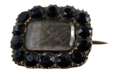 Lot 364 - A Victorian memorial brooch, the border set...