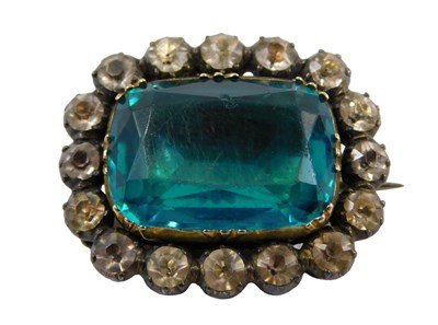 Lot 365 - A silver gilt memorial brooch, set with paste...