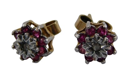 Lot 371 - A pair of 9ct gold ruby and CZ floral cluster...