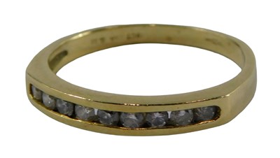 Lot 403 - An 18ct gold diamond half hoop dress ring, set...