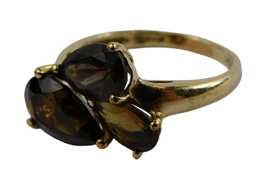 Lot 407 - A 9ct gold smokey quartz and quartz dress ring,...