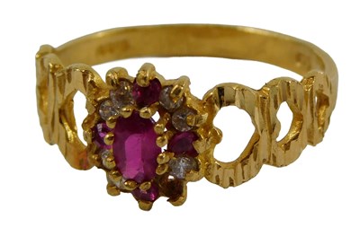 Lot 411 - A 22ct gold ruby and diamond dress ring, the...