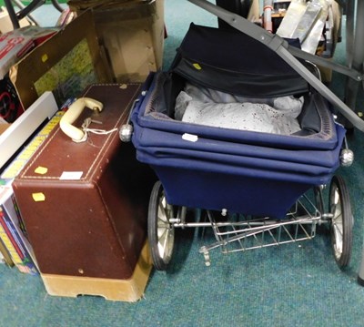 Lot 2097 - A silver cross, toy pram, and a leatherette...