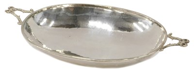 Lot 454 - A George V oval beaten silver dish, with two...