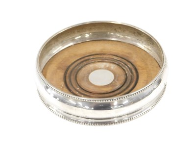 Lot 508 - An Elizabeth II silver circular wine...