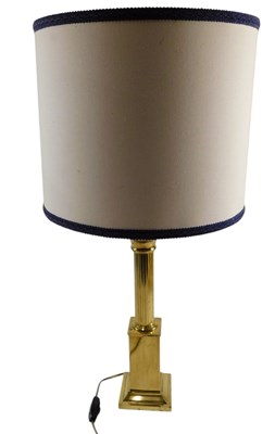 Lot 541 - A brass table lamp, with a reeded column, on a...