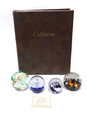 Lot 558 - Four Caithness glass paperweights, comprising...