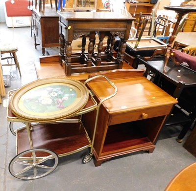Lot 1515 - A nest of three carved dark oak tables, with...
