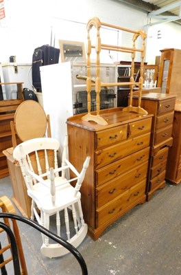 Lot 1526 - A pair of pine three drawer bedside cabinets,...
